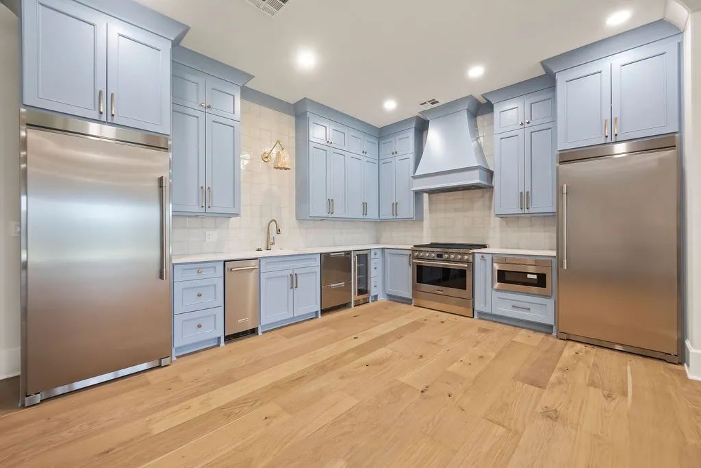 Cabinet refinishing in a soft blue painted finish